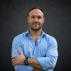 Droz headshot dark studio backdrop